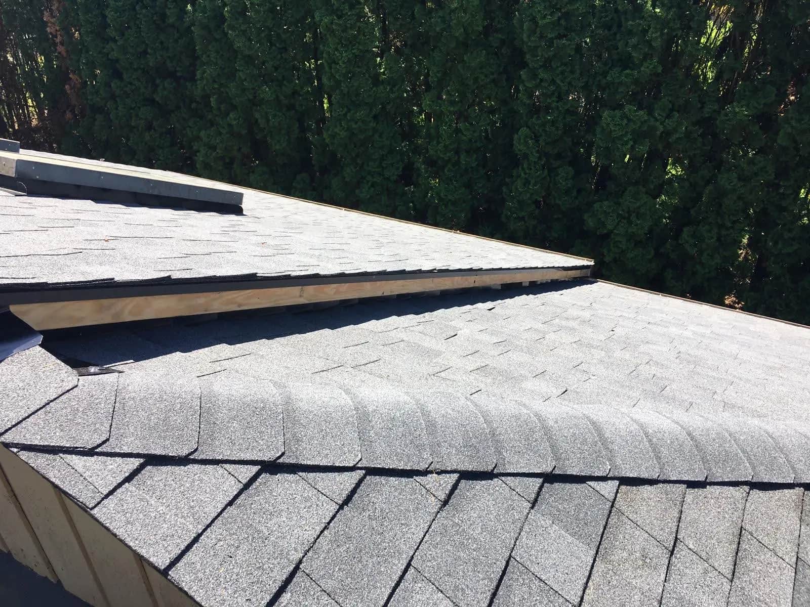Completed shingle roof after storm recovery